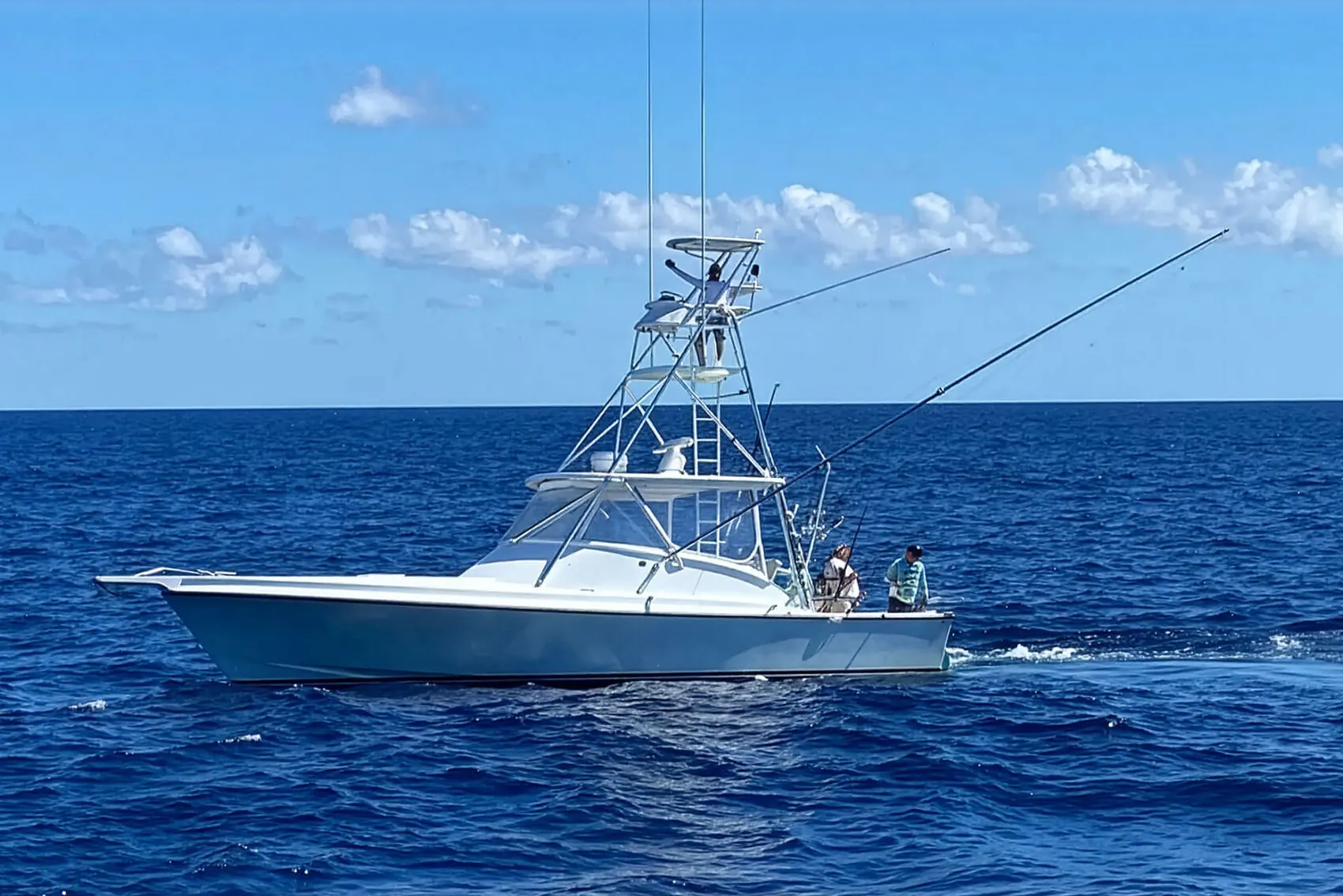 The DirtyBoat sportfishing boat running offshore with lines out